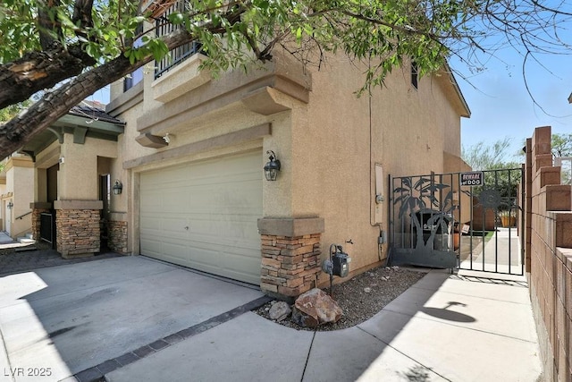9105 Picket Fence Ave, Las Vegas, NV 89143 - view of side of home with stucco siding, driveway, a gate, a garage, and stone siding