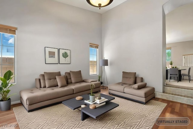 9105 Picket Fence Ave, Las Vegas, NV 89143 - living area with wood finished floors and a towering ceiling