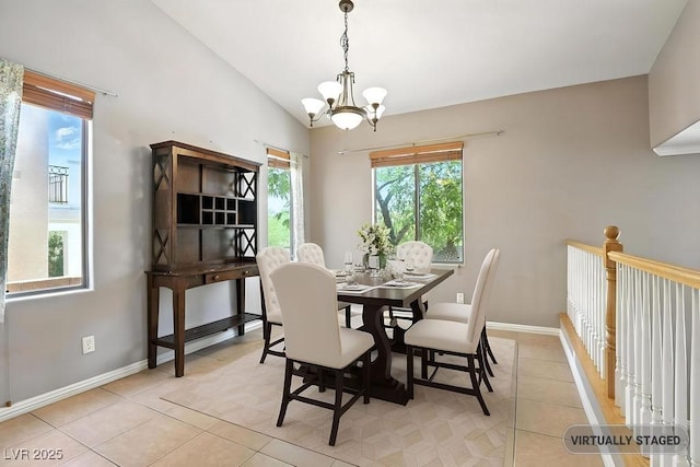 9105 Picket Fence Ave, Las Vegas, NV 89143 - dining area featuring a chandelier, light tile patterned flooring, and vaulted ceiling