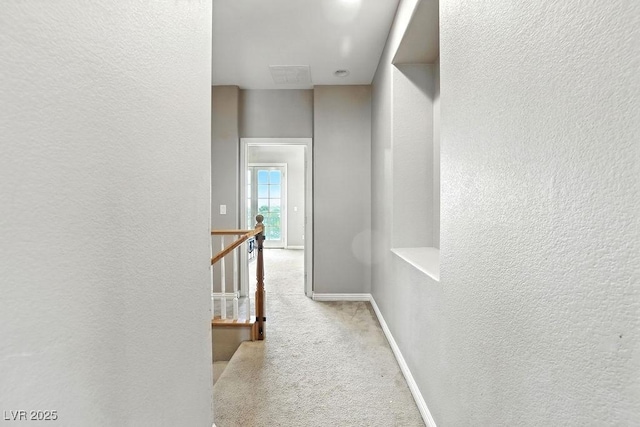 9105 Picket Fence Ave, Las Vegas, NV 89143 - corridor featuring a textured wall, an upstairs landing, and carpet flooring