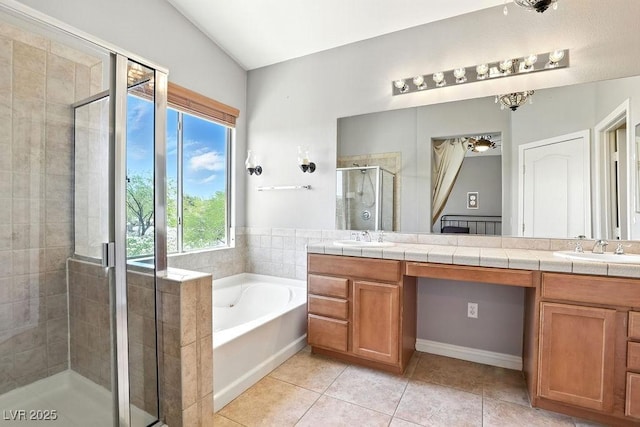 9105 Picket Fence Ave, Las Vegas, NV 89143 - bathroom featuring double vanity, a stall shower, a bath, and tile patterned flooring