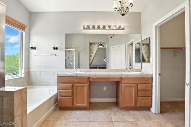 9105 Picket Fence Ave, Las Vegas, NV 89143 - bathroom featuring a shower stall, double vanity, a garden tub, and tile patterned floors