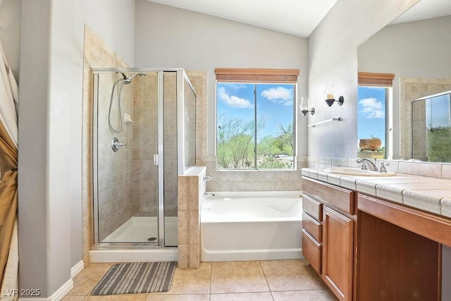 9105 Picket Fence Ave, Las Vegas, NV 89143 - bathroom with a bath, a stall shower, tile patterned floors, vanity, and vaulted ceiling