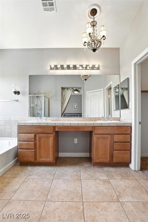 9105 Picket Fence Ave, Las Vegas, NV 89143 - full bath with a stall shower, vanity, a bath, tile patterned floors, and a chandelier