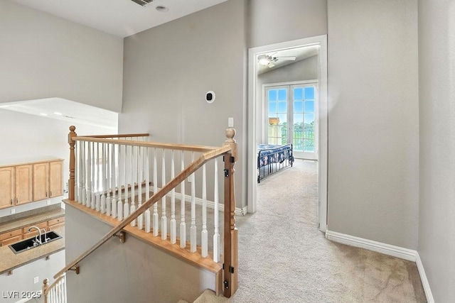 9105 Picket Fence Ave, Las Vegas, NV 89143 - stairway featuring carpet and lofted ceiling