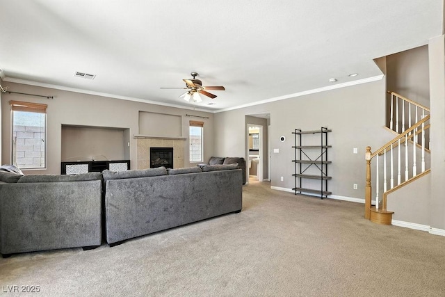 9105 Picket Fence Ave, Las Vegas, NV 89143 - carpeted living area featuring ceiling fan, stairs, ornamental molding, and a fireplace