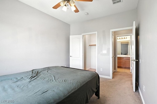 9105 Picket Fence Ave, Las Vegas, NV 89143 - bedroom with light carpet, ceiling fan, and a spacious closet
