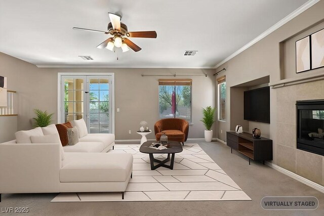 9105 Picket Fence Ave, Las Vegas, NV 89143 - living area featuring ceiling fan, light carpet, ornamental molding, and a fireplace