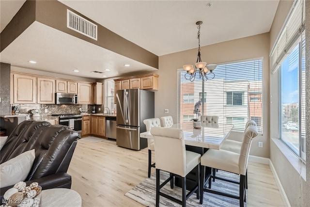 63 E Agate Ave Unit 509, Las Vegas, NV 89123 - dining room with a chandelier, plenty of natural light, light wood-style floors, and recessed lighting