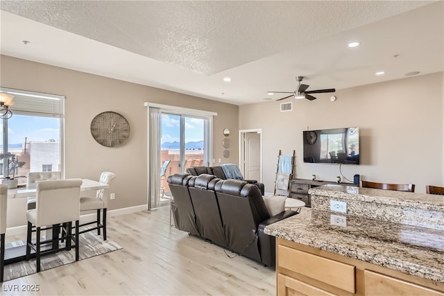63 E Agate Ave Unit 509, Las Vegas, NV 89123 - living area with a textured ceiling, light wood-style flooring, ceiling fan, and recessed lighting