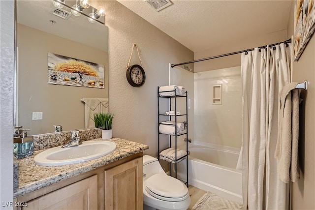 63 E Agate Ave Unit 509, Las Vegas, NV 89123 - full bathroom featuring shower / tub combo, vanity, a textured wall, and wood finished floors