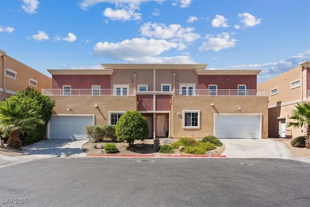5603 Deer Creek Falls Ct, Las Vegas, NV 89118 - view of front facade featuring stucco siding, driveway, a garage, and a balcony