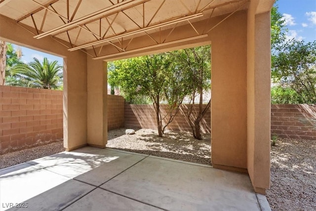 5603 Deer Creek Falls Ct, Las Vegas, NV 89118 - fenced backyard with a patio