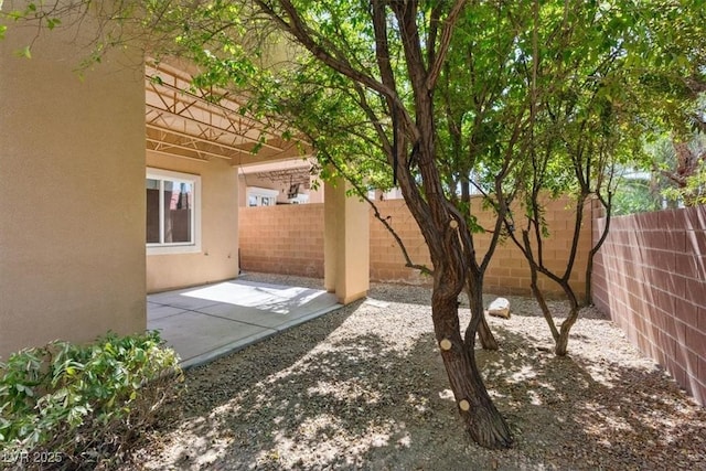 5603 Deer Creek Falls Ct, Las Vegas, NV 89118 - fenced backyard with a patio