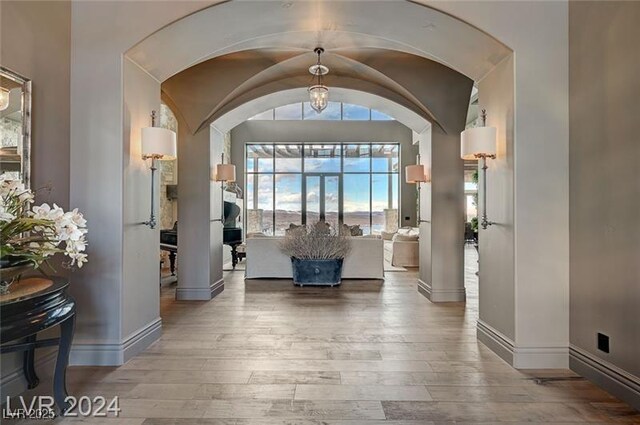 30 Via Tiberius Way, Henderson, NV 89011 - entryway with hardwood / wood-style floors, arched walkways, and vaulted ceiling