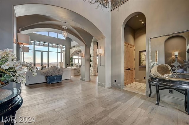 30 Via Tiberius Way, Henderson, NV 89011 - foyer with wood finished floors, arched walkways, and a high ceiling