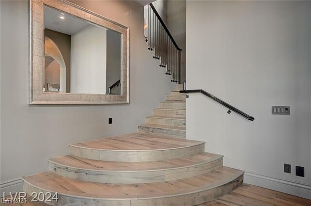 30 Via Tiberius Way, Henderson, NV 89011 - stairs with wood finished floors and baseboards