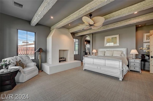 30 Via Tiberius Way, Henderson, NV 89011 - bedroom with beamed ceiling, carpet floors, multiple windows, and arched walkways