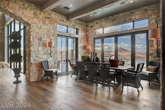 30 Via Tiberius Way, Henderson, NV 89011 - dining area with beamed ceiling, wood-type flooring, a high ceiling, and healthy amount of natural light