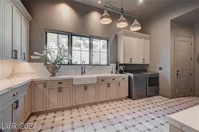 30 Via Tiberius Way, Henderson, NV 89011 - kitchen featuring light floors, washer and dryer, light countertops, tasteful backsplash, and decorative light fixtures