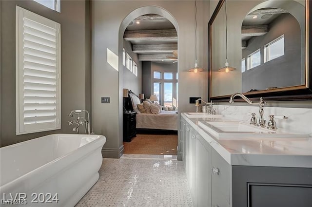 30 Via Tiberius Way, Henderson, NV 89011 - ensuite bathroom featuring double vanity, a freestanding bath, and speckled floor