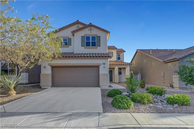 1069 Aspen Cliff Dr, Henderson, NV 89011 - mediterranean / spanish-style house featuring stucco siding, driveway, an attached garage, and a tile roof