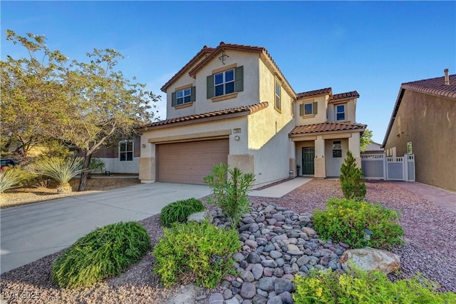 1069 Aspen Cliff Dr, Henderson, NV 89011 - mediterranean / spanish-style house featuring a tiled roof, a garage, stucco siding, and driveway