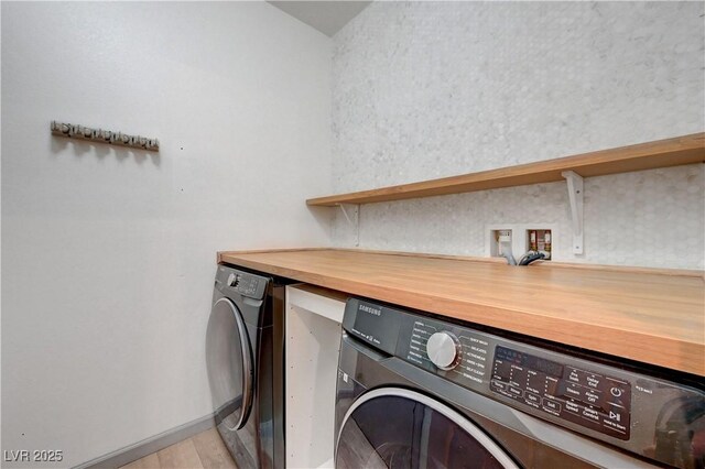 1069 Aspen Cliff Dr, Henderson, NV 89011 - laundry area with washer / clothes dryer and light wood-type flooring