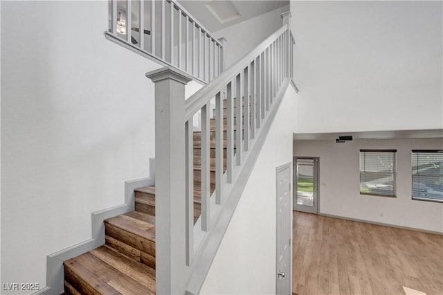 1069 Aspen Cliff Dr, Henderson, NV 89011 - staircase featuring wood finished floors and a towering ceiling
