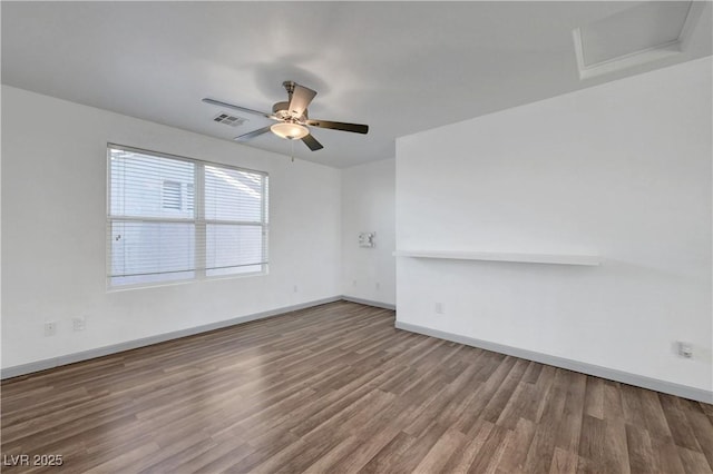 1069 Aspen Cliff Dr, Henderson, NV 89011 - spare room with wood finished floors, attic access, and a ceiling fan