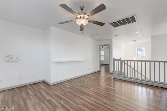 1069 Aspen Cliff Dr, Henderson, NV 89011 - empty room with a ceiling fan, wood finished floors, and recessed lighting