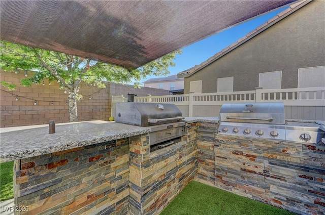 1069 Aspen Cliff Dr, Henderson, NV 89011 - view of patio / terrace with an outdoor kitchen