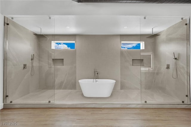 5015 Thunder River Cir, Las Vegas, NV 89148 - bathroom with a marble finish shower, wood finished floors, and a freestanding tub