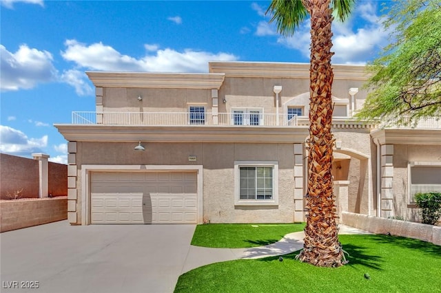 5015 Thunder River Cir, Las Vegas, NV 89148 - view of front of home featuring driveway, an attached garage, stucco siding, a balcony, and a front lawn