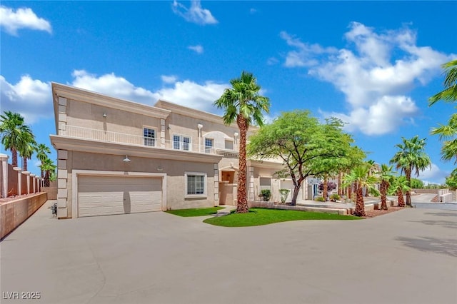 5015 Thunder River Cir, Las Vegas, NV 89148 - view of front facade with driveway, stucco siding, an attached garage, and a balcony