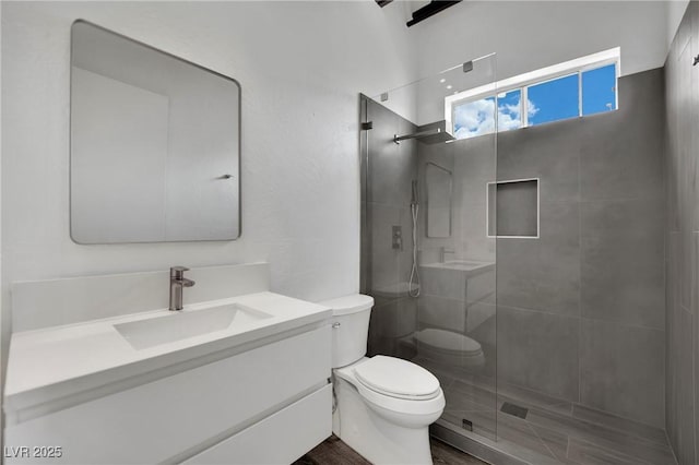 5015 Thunder River Cir, Las Vegas, NV 89148 - full bathroom featuring a tile shower, vanity, and wood finished floors