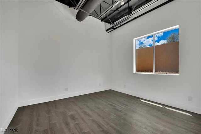 5015 Thunder River Cir, Las Vegas, NV 89148 - unfurnished room with baseboards and dark wood-type flooring
