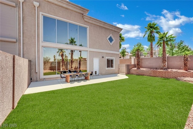 5015 Thunder River Cir, Las Vegas, NV 89148 - back of property featuring stucco siding, a fenced backyard, and a patio