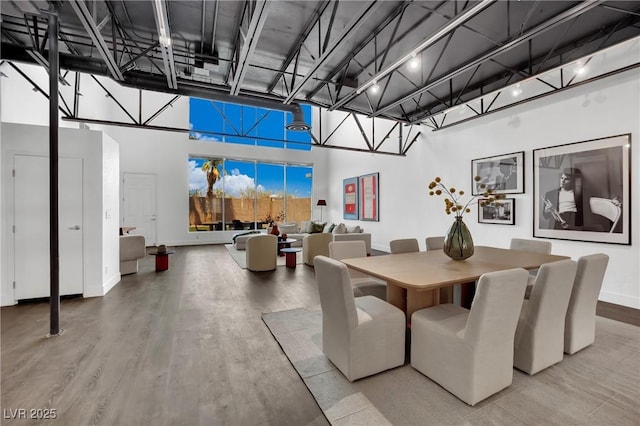 5015 Thunder River Cir, Las Vegas, NV 89148 - dining area featuring a towering ceiling and wood finished floors