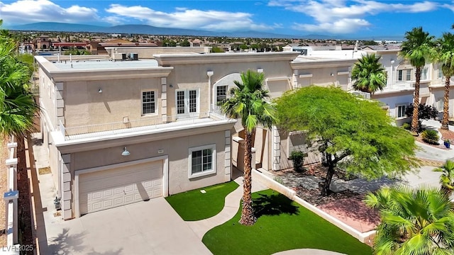 5015 Thunder River Cir, Las Vegas, NV 89148 - view of front of property with an attached garage, concrete driveway, stucco siding, and a residential view
