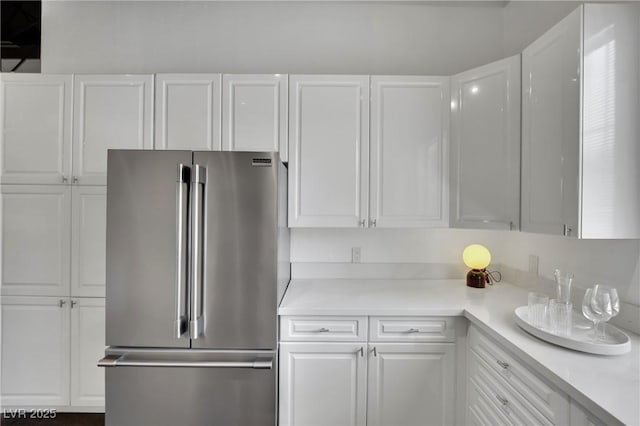 5015 Thunder River Cir, Las Vegas, NV 89148 - kitchen featuring high end fridge, white cabinets, and light countertops