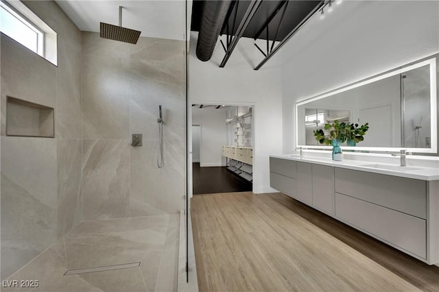 5015 Thunder River Cir, Las Vegas, NV 89148 - bathroom with walk in shower, double vanity, and wood finished floors