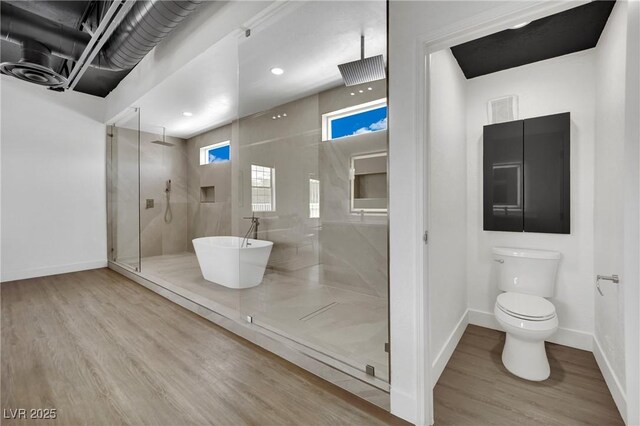 5015 Thunder River Cir, Las Vegas, NV 89148 - bathroom with a walk in shower, wood finished floors, and a freestanding tub