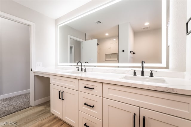 5417 Bible Cir, North Las Vegas, NV 89031 - bathroom featuring double vanity and wood finished floors