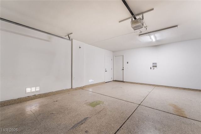 5417 Bible Cir, North Las Vegas, NV 89031 - garage with a garage door opener and baseboards