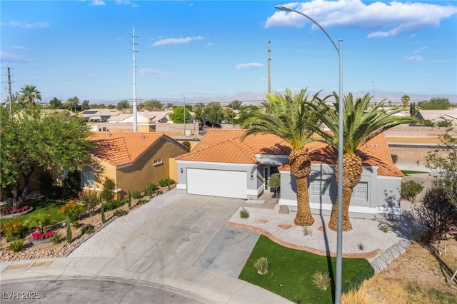 5417 Bible Cir, North Las Vegas, NV 89031 - view of front of house featuring driveway, stucco siding, a tile roof, a garage, and a residential view