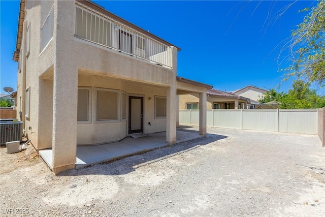3828 Prairie Orchid Ave, North Las Vegas, NV 89081 - back of house with stucco siding and a patio area