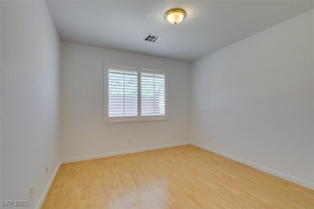 10513 Shanna Trellis Ave, Las Vegas, NV 89144 - unfurnished room featuring light wood-style floors and baseboards