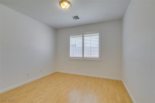 10513 Shanna Trellis Ave, Las Vegas, NV 89144 - empty room with wood finished floors and baseboards