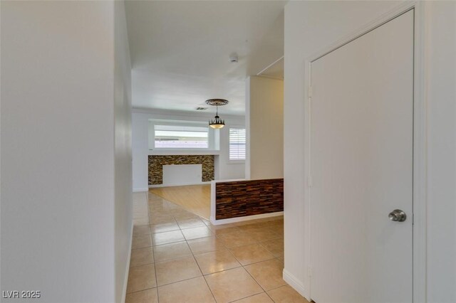 10513 Shanna Trellis Ave, Las Vegas, NV 89144 - corridor with light tile patterned floors and baseboards